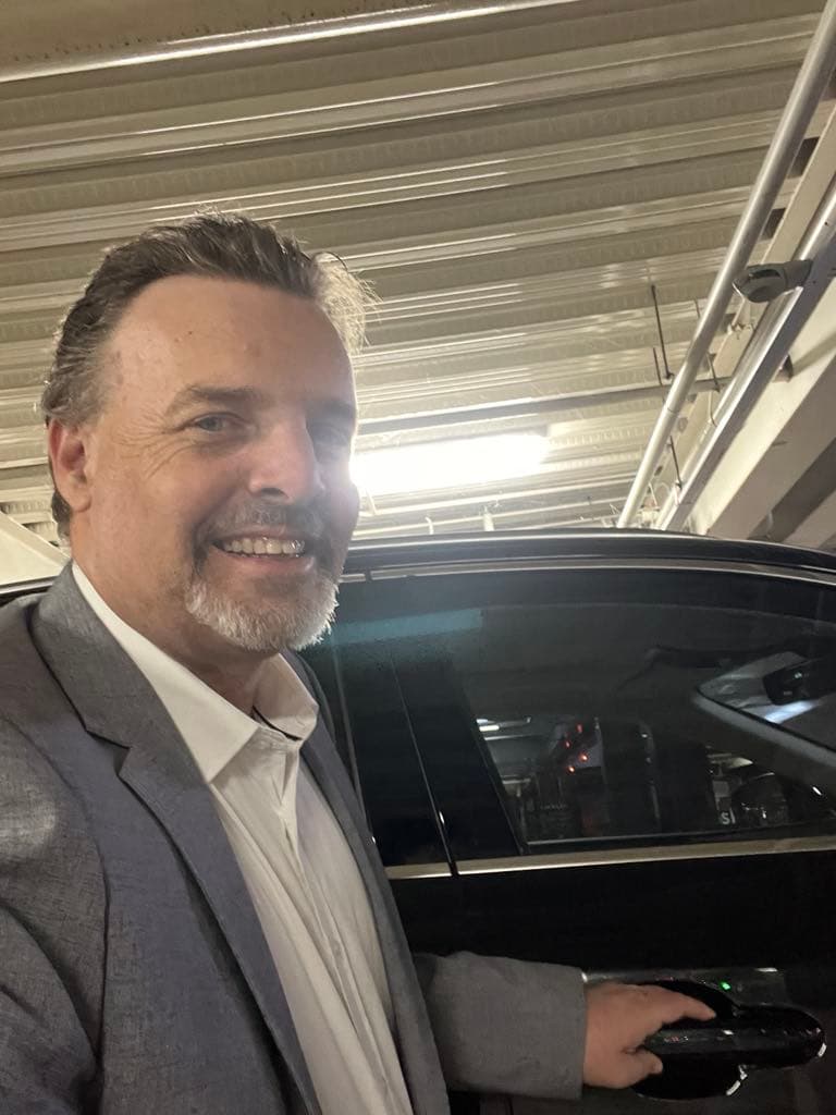 Driver with a Lexus private transfer vehicle